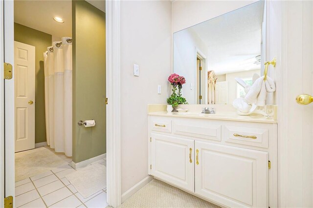 1605 Ridge Rd, Leavenworth, KS 66048 - bathroom with vanity, baseboards, a shower with curtain, and tile patterned flooring