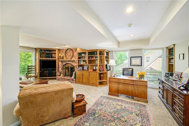 1605 Ridge Rd, Leavenworth, KS 66048 - home office with healthy amount of natural light, a fireplace, and light colored carpet