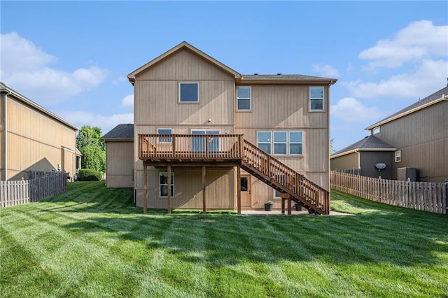 back of property featuring stairs and a wooden deck