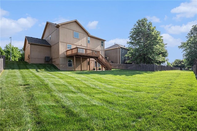 rear view of property with stairway and a deck