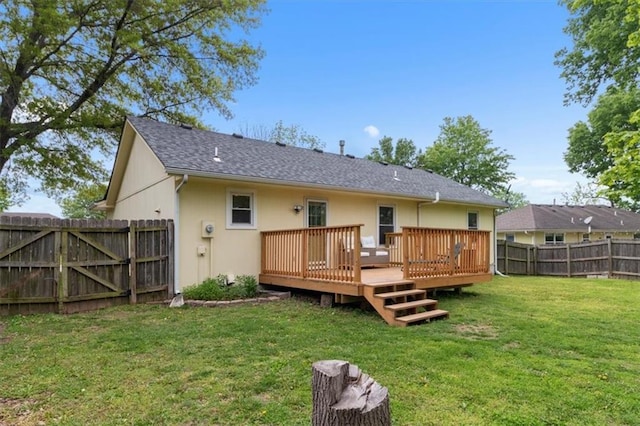 back of property featuring a deck, roof with shingles, and stucco siding
