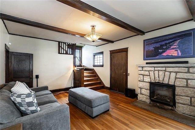 108 W 61st Ter, Kansas City, MO 64113 - living area with stairway, wood finished floors, beam ceiling, baseboards, and a fireplace
