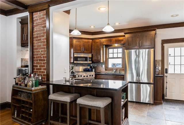 108 W 61st Ter, Kansas City, MO 64113 - kitchen with appliances with stainless steel finishes, a sink, tasteful backsplash, decorative light fixtures, and recessed lighting