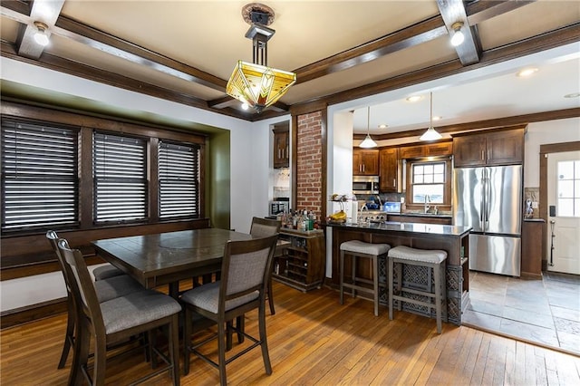 108 W 61st Ter, Kansas City, MO 64113 - dining room featuring hardwood / wood-style flooring and ornamental molding