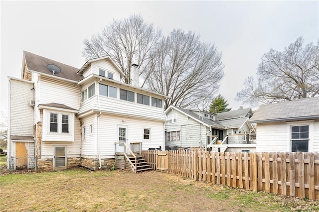 108 W 61st Ter, Kansas City, MO 64113 - rear view of house featuring a chimney