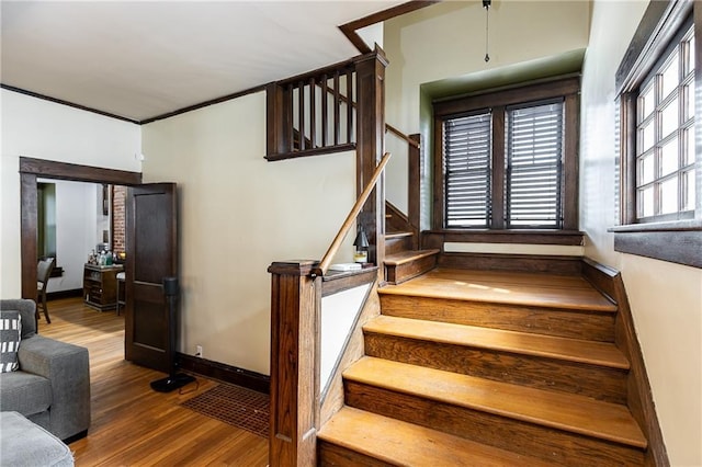108 W 61st Ter, Kansas City, MO 64113 - stairs featuring wood finished floors and baseboards