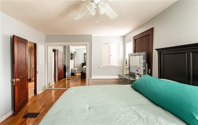 108 W 61st Ter, Kansas City, MO 64113 - bedroom with wood finished floors, ceiling fan, and baseboards