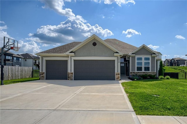 9424 N Belleview Ave, Kansas City, MO 64155 - view of front facade with stone siding, a garage, stucco siding, and concrete driveway