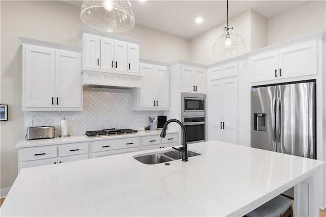 9424 N Belleview Ave, Kansas City, MO 64155 - kitchen with a sink, stainless steel appliances, tasteful backsplash, white cabinetry, and recessed lighting
