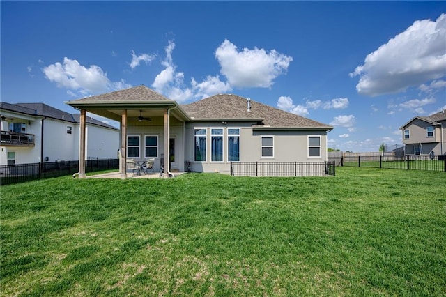 9424 N Belleview Ave, Kansas City, MO 64155 - rear view of house with a ceiling fan, a patio, stucco siding, and a shingled roof