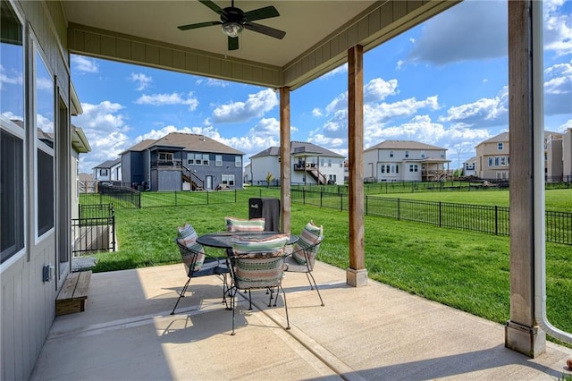 9424 N Belleview Ave, Kansas City, MO 64155 - view of patio / terrace with a residential view, outdoor dining space, and ceiling fan