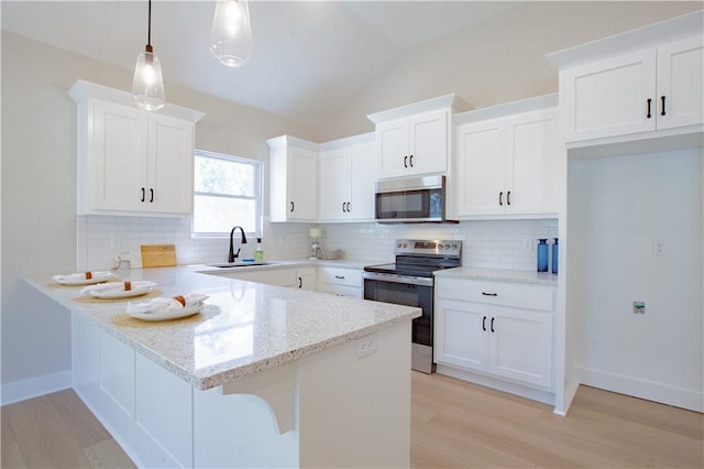 606 E 3rd St, Cameron, MO 64429 - kitchen featuring stainless steel appliances, a peninsula, light wood-type flooring, white cabinets, and a sink