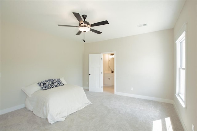 606 E 3rd St, Cameron, MO 64429 - bedroom featuring light carpet, multiple windows, and baseboards