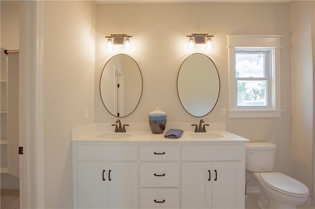 606 E 3rd St, Cameron, MO 64429 - full bathroom featuring toilet and double vanity
