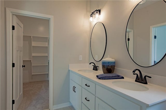 606 E 3rd St, Cameron, MO 64429 - bathroom with double vanity and a spacious closet