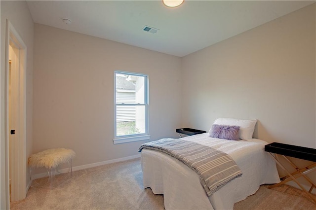 606 E 3rd St, Cameron, MO 64429 - bedroom with baseboards and light colored carpet