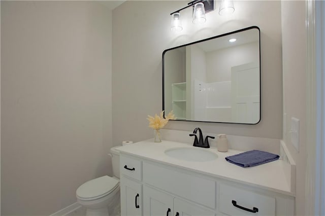606 E 3rd St, Cameron, MO 64429 - bathroom featuring toilet, vanity, and baseboards