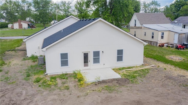606 E 3rd St, Cameron, MO 64429 - back of property featuring a patio area and central AC unit