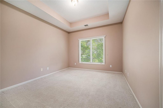 6209 NW 78th St, Kansas City, MO 64151 - carpeted spare room with baseboards and a raised ceiling