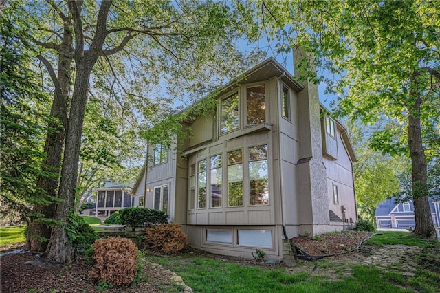 6209 NW 78th St, Kansas City, MO 64151 - view of side of home with a chimney