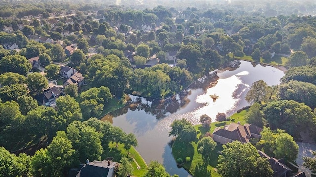 6209 NW 78th St, Kansas City, MO 64151 - aerial view of property and surrounding area with a nearby body of water and a forest