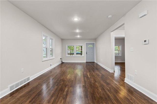 3107 N 34th St, Kansas City, KS 66104 - empty room with dark wood-style flooring and baseboards