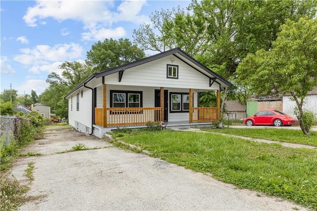 3107 N 34th St, Kansas City, KS 66104 - bungalow featuring a porch and driveway