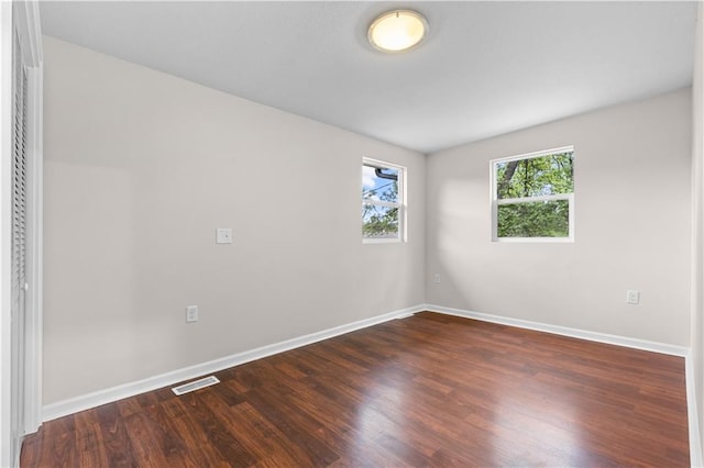 3107 N 34th St, Kansas City, KS 66104 - unfurnished room with dark wood finished floors and baseboards