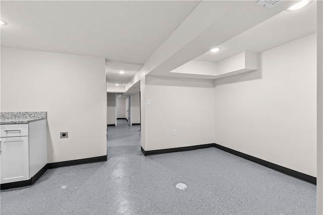 3107 N 34th St, Kansas City, KS 66104 - finished below grade area featuring baseboards and recessed lighting