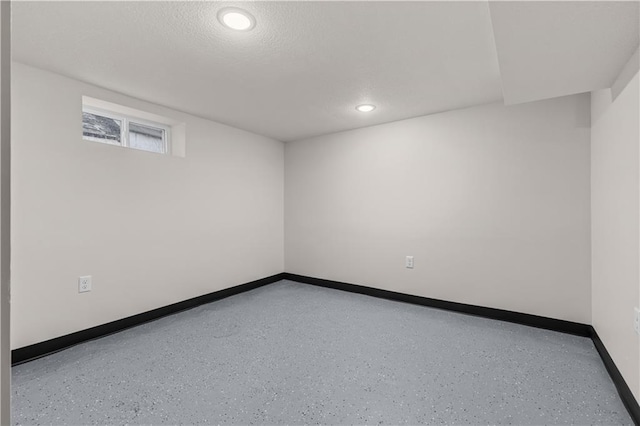 3107 N 34th St, Kansas City, KS 66104 - below grade area featuring baseboards, recessed lighting, and a textured ceiling
