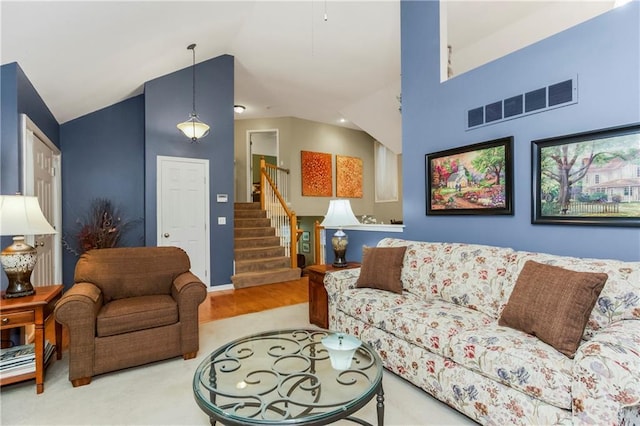 5162 Roundtree St, Shawnee, KS 66226 - living area featuring lofted ceiling and stairs
