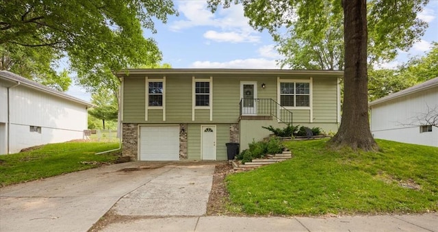 808 SE 19th St, Oak Grove, MO 64075 - view of front of property with a front lawn, concrete driveway, an attached garage, and brick siding