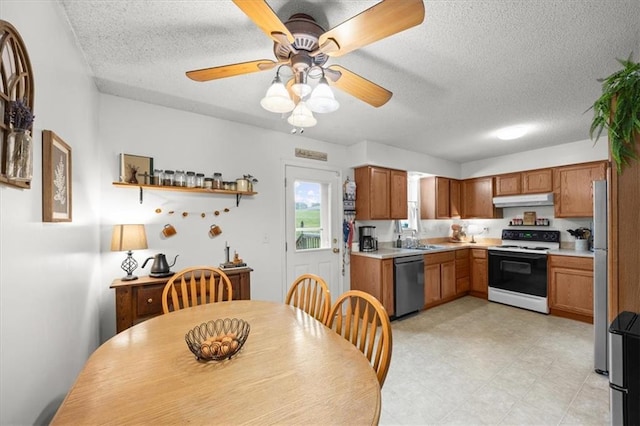 808 SE 19th St, Oak Grove, MO 64075 - kitchen featuring electric range, dishwashing machine, under cabinet range hood, a textured ceiling, and light countertops