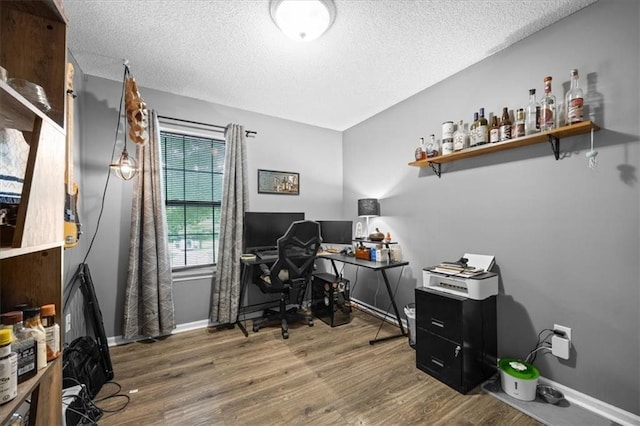808 SE 19th St, Oak Grove, MO 64075 - office with a textured ceiling, wood finished floors, and baseboards