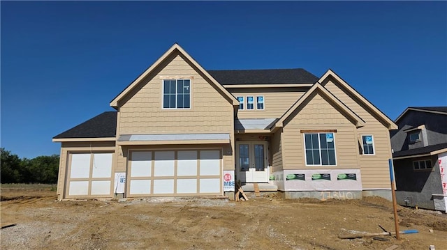 view of front of house featuring french doors and a garage