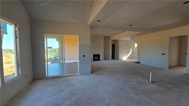 unfurnished room featuring a fireplace