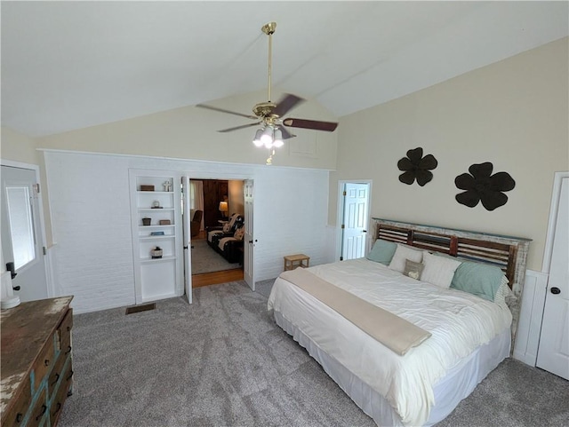 carpeted bedroom with vaulted ceiling and ceiling fan