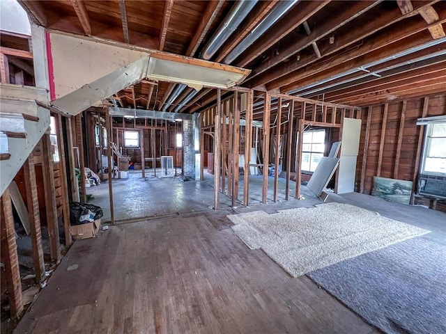 misc room featuring stairway and wood finished floors
