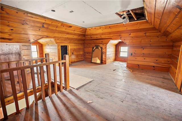 511 E 9th St, Trenton, MO 64683 - additional living space with healthy amount of natural light, wood walls, wood-type flooring, and lofted ceiling