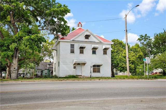 511 E 9th St, Trenton, MO 64683 - view of front of property with a chimney and metal roof