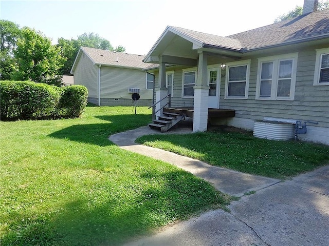 2011 S Broadway St, Pittsburg, KS 66762 - view of home's exterior with a yard, a chimney, and a porch