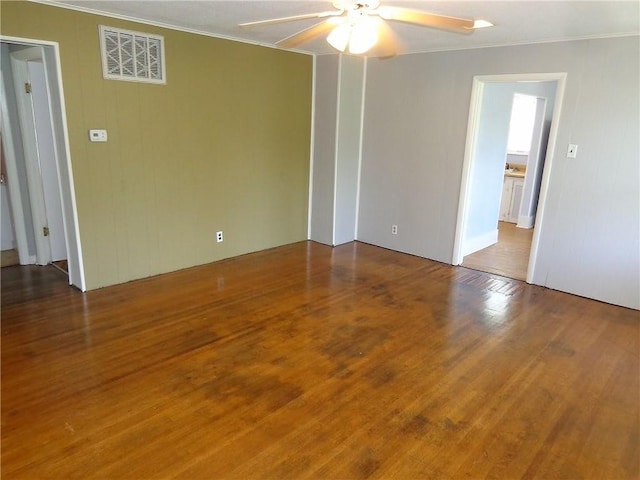 2011 S Broadway St, Pittsburg, KS 66762 - empty room with ornamental molding, ceiling fan, and wood finished floors