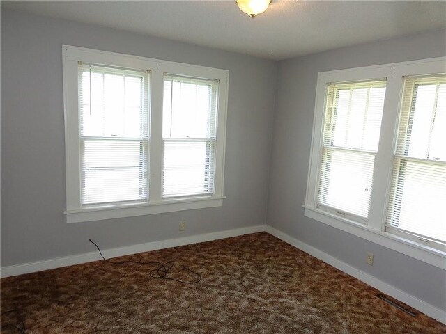 2011 S Broadway St, Pittsburg, KS 66762 - carpeted spare room featuring healthy amount of natural light and baseboards