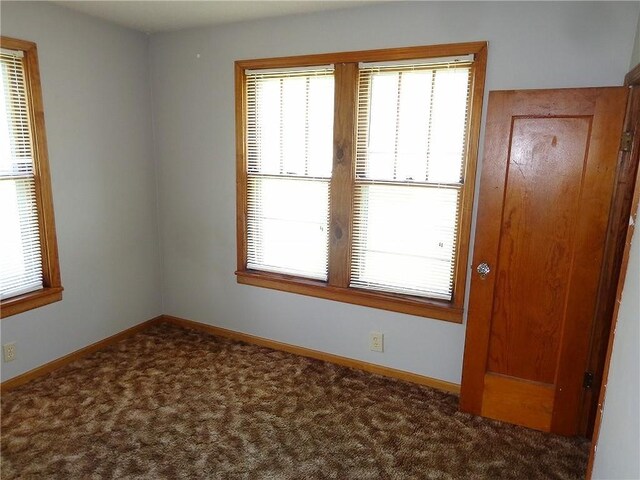 2011 S Broadway St, Pittsburg, KS 66762 - spare room featuring carpet floors and baseboards
