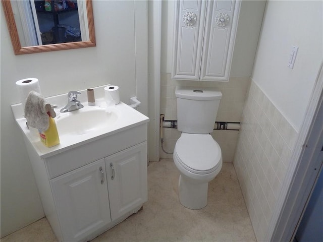 2011 S Broadway St, Pittsburg, KS 66762 - bathroom with vanity, toilet, and tile walls