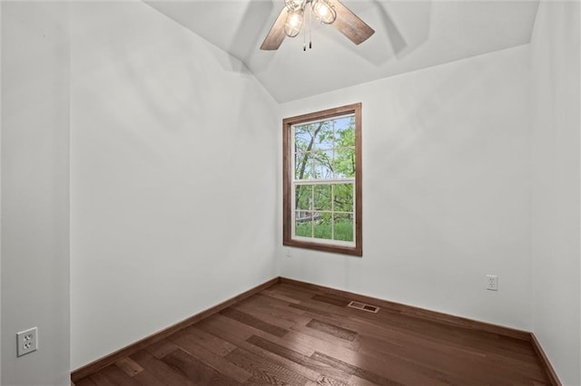 13 S Lakeside Cir, Linn Valley, KS 66040 - spare room featuring dark wood finished floors, ceiling fan, lofted ceiling, and baseboards