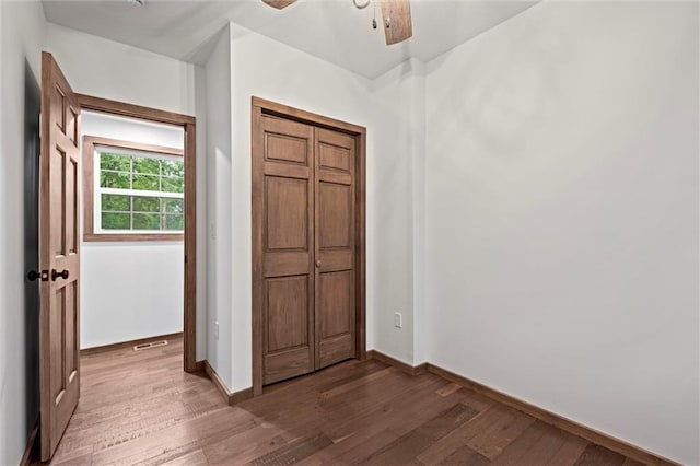 13 S Lakeside Cir, Linn Valley, KS 66040 - unfurnished bedroom with wood finished floors, baseboards, a closet, and ceiling fan