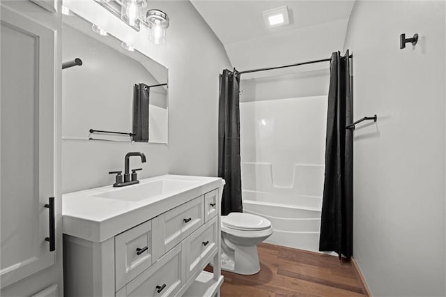 13 S Lakeside Cir, Linn Valley, KS 66040 - bathroom with wood finished floors, vanity, toilet, shower / bath combination with curtain, and lofted ceiling