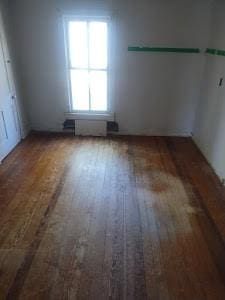 spare room with wood finished floors
