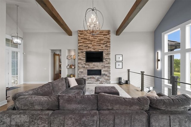10523 N Dalton Ave, Kansas City, MO 64154 - living room with a chandelier, high vaulted ceiling, beamed ceiling, wood finished floors, and baseboards
